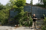 chernobyl 73 pripyat ghosttown greenhouse and a tourist.jpg